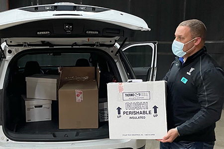 Interim Oak Park Public Heal Director Joseph Terry delivers the first shipment of COVID-19 vaccine.